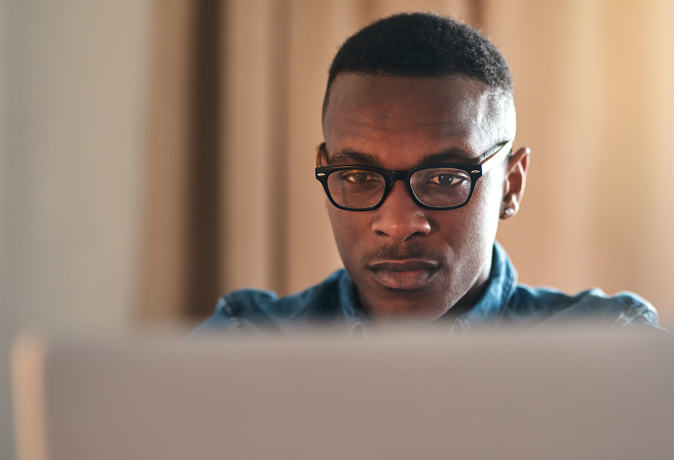 A reviewer at a laptop